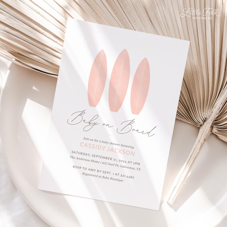 May include: Pink baby shower invitation with three pink surfboards and the text "Baby on Board". The invitation includes the date, time, and location of the shower, as well as the name of the guest of honor, Cassidy Jackson.