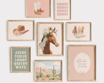 May include: A collection of framed art prints with a Western theme. Prints include cowboy boots, a cowboy hat, a horse with a floral crown, a desert landscape, and the word "HOWDY" repeated. The prints are in soft, muted colors.