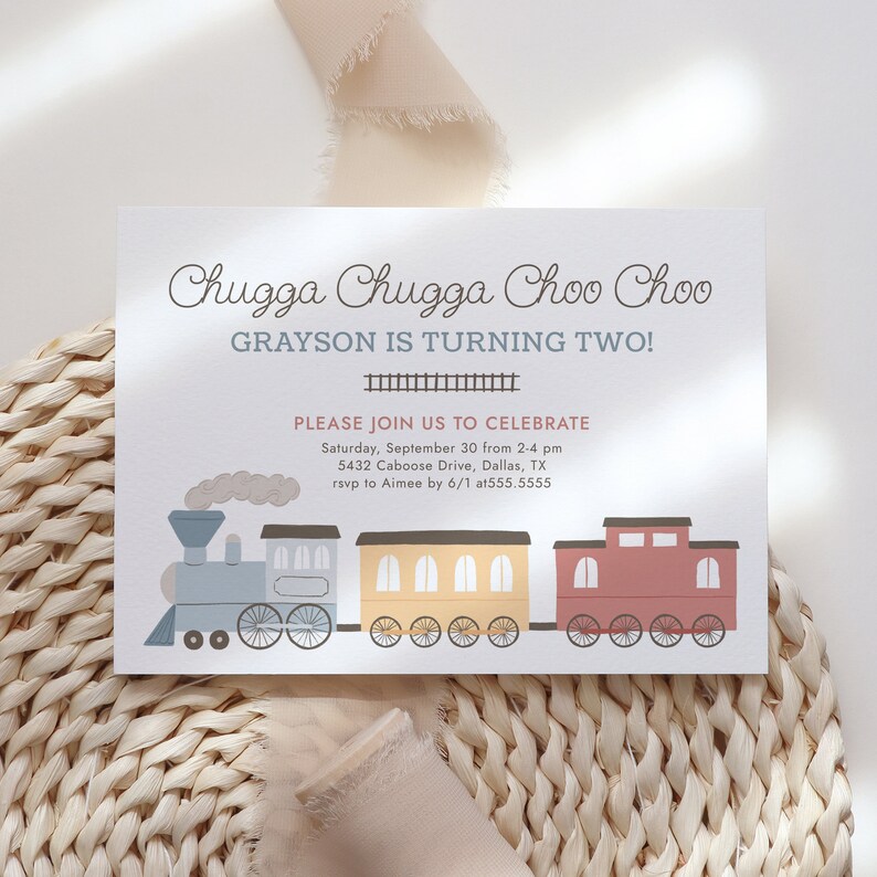 May include: A birthday invitation with a train illustration. The text reads "Chugga Chugga Choo Choo, Grayson is turning two!" and includes event details. The train is composed of blue, yellow, and red train cars.