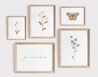 May include: Five framed prints on a white wall. The prints feature floral illustrations and the text "you are so loved".