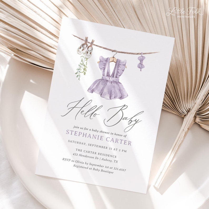 May include: A baby shower invitation with watercolor illustrations of baby clothes hanging on a clothesline. The invitation reads "Hello Baby" and includes event details for Stephanie Carter's baby shower.