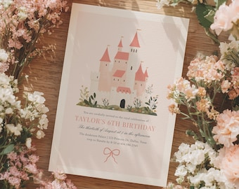 May include: A birthday invitation featuring a pink castle illustration with pink and white accents. The text reads "TAYLOR'S 6TH BIRTHDAY" and includes event details. The invitation is surrounded by pink and white flowers on a wooden surface.