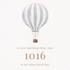 May include: A watercolor illustration of a light blue and white striped hot air balloon with a brown basket. To view matching items, type 1016 in our shop search bar.