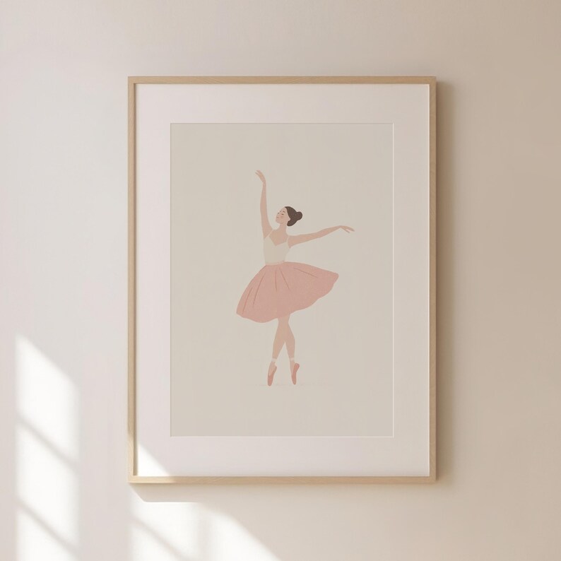 May include: A framed print featuring a minimalist illustration of a ballerina. The dancer is depicted in a graceful pose, wearing a pink tutu and pointe shoes. The artwork has a soft, neutral color palette, with a light background and a wooden frame.