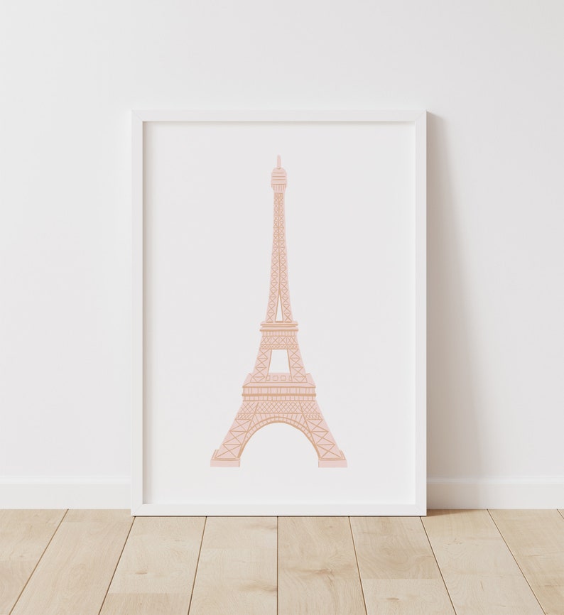 May include: A white framed print of a pink outline of the Eiffel Tower on a white background.