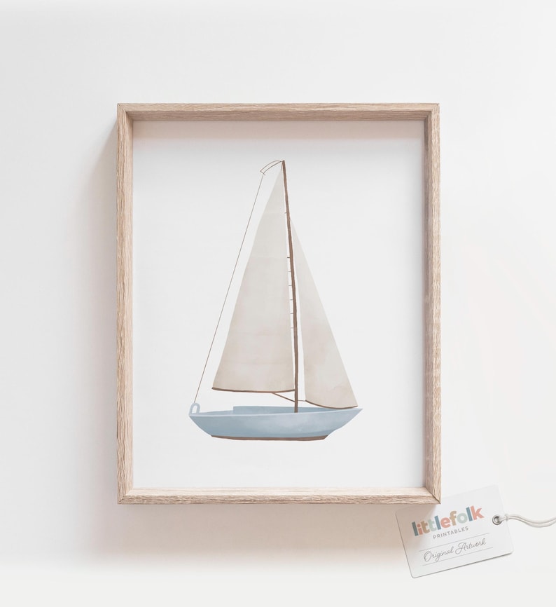 May include: A framed print of a watercolour illustration of a sailboat with a white sail and a light blue hull. The print is on a white background and has a wooden frame.