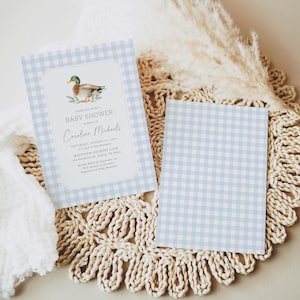 May include: A blue and white gingham baby shower invitation with a watercolor illustration of a duck. The invitation reads "Kindly join us for a baby shower in honor of Caroline Michaels, Saturday, August 31, 2024, 2 o'clock in the afternoon, Westview Country Club, 412 Henderson Dr, Aubrey, TX 76227. Kindly RSVP by September 1st.  Registered at Baby Boutique."
