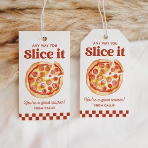 May include: Two white gift tags with a pizza illustration and the text "ANY WAY YOU SLICE IT". The tags also read "You're a great teacher! FROM CALLIE" and have a red and white checkered border.
