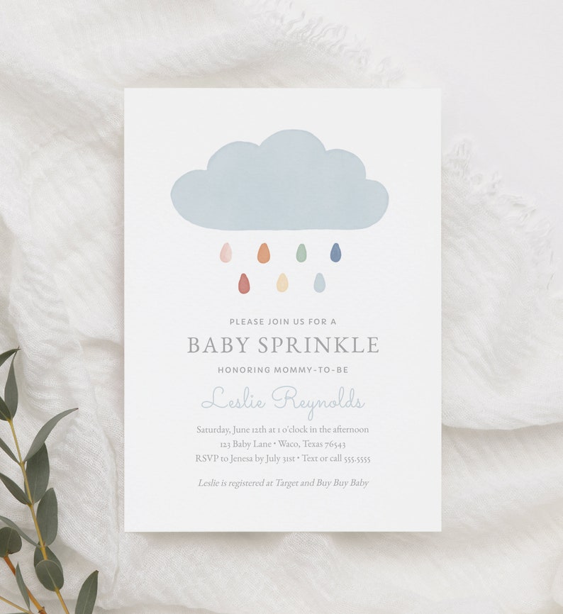 May include: A baby sprinkle invitation featuring a blue cloud and colourful raindrops. The invitation reads "Please join us for a baby sprinkle honouring mommy-to-be Leslie Reynolds". The date, time, location, RSVP details, and registry information are also provided.