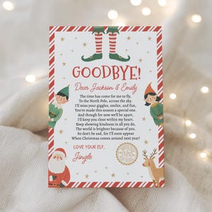 May include: A rectangular card with a red and white candy cane border featuring illustrations of elf legs, two elves, Santa Claus, and a reindeer. The text reads: GOODBYE! Dear Jackson & Emily. The time has come for me to fly, LOVE YOUR ELF, Jingle.