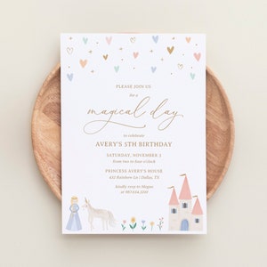 May include: A white invitation with gold lettering for a 5th birthday party. The invitation features a princess and unicorn illustration, a castle, and a scattering of hearts in pink, blue, and gold. The text reads "Please join us for a magical day to celebrate Avery's 5th Birthday, Saturday, November 3 from two to four o'clock, Princess Avery's House, 432 Rainbow Ln / Dallas, TX, kindly rsvp to Megan at 987.654.3210."