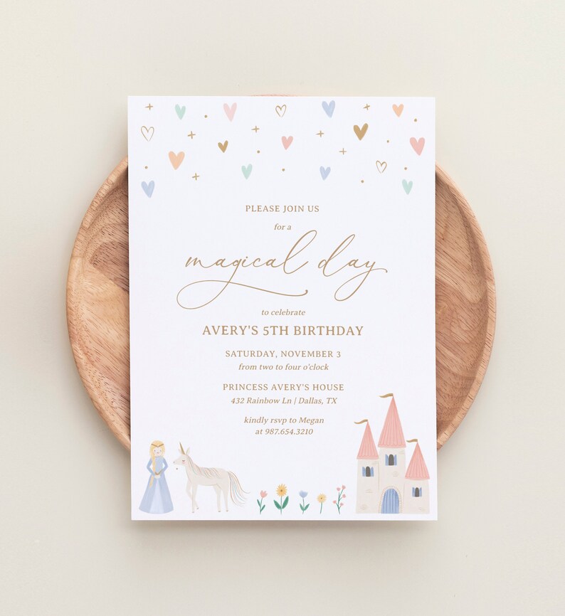 May include: A white invitation with gold lettering for a 5th birthday party. The invitation features a princess and unicorn illustration, a castle, and a scattering of hearts in pink, blue, and gold. The text reads "Please join us for a magical day to celebrate Avery's 5th Birthday, Saturday, November 3 from two to four o'clock, Princess Avery's House, 432 Rainbow Ln / Dallas, TX, kindly rsvp to Megan at 987.654.3210."