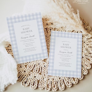May include: Two blue and white gingham baby shower invitations with the text "Kindly join us for a Baby Shower in honor of Georgia Smith" and the date "Saturday, September 1st, 2014 at 2 o'clock in the afternoon".