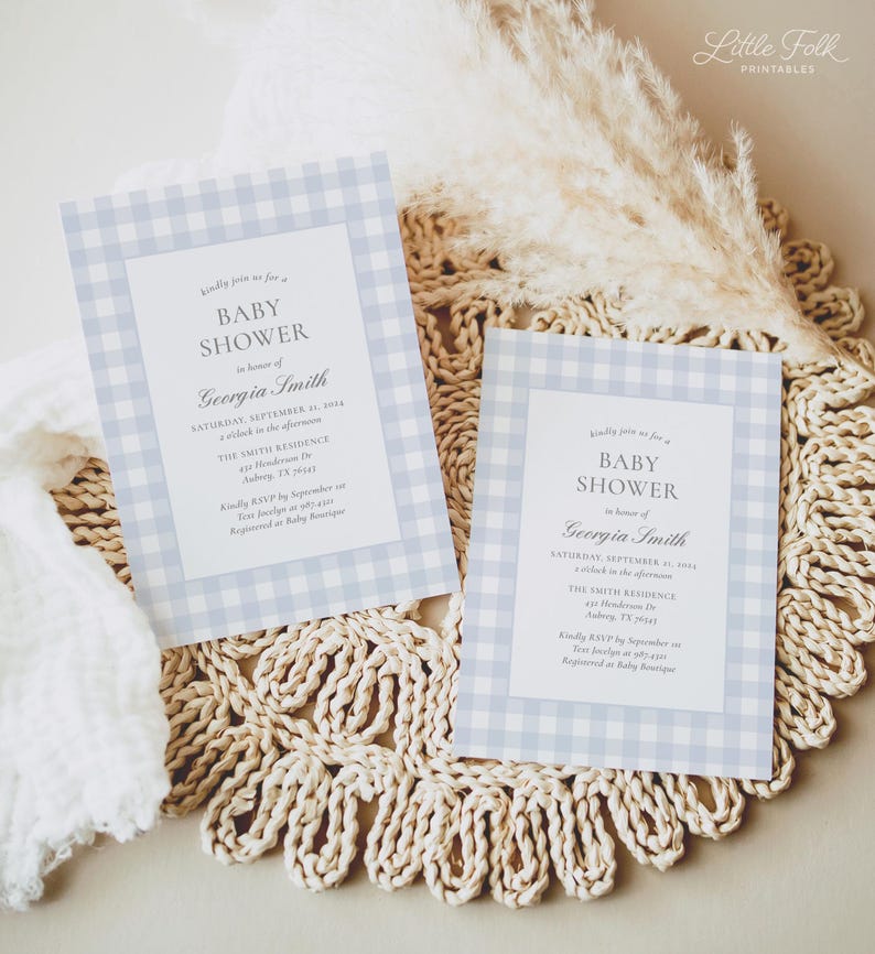 May include: Two blue and white gingham baby shower invitations with the text "Kindly join us for a Baby Shower in honor of Georgia Smith" and the date "Saturday, September 1st, 2014 at 2 o'clock in the afternoon".