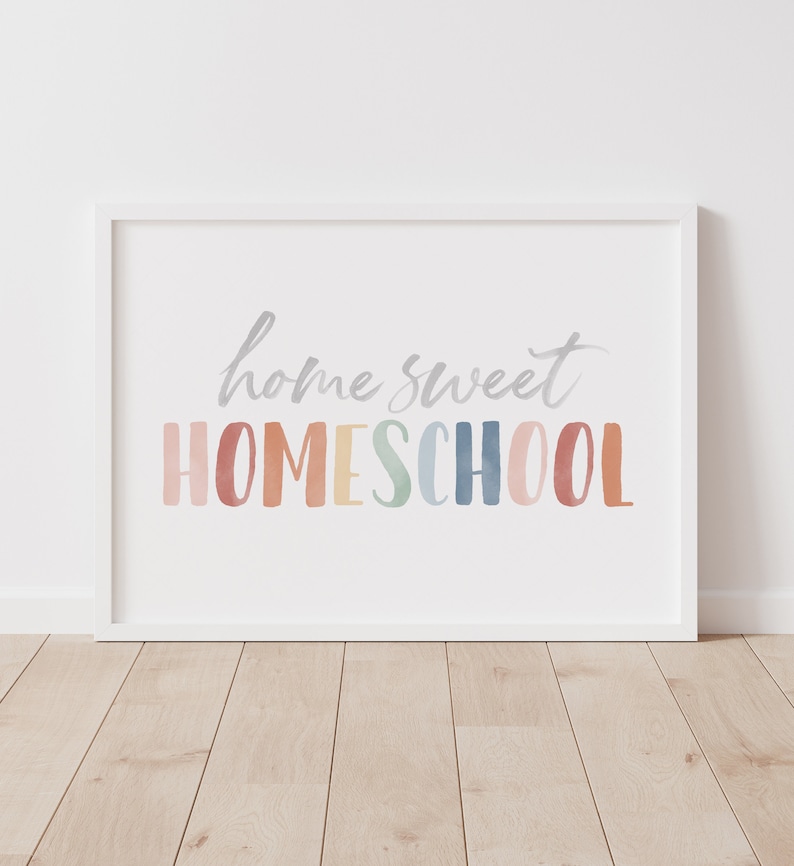 May include: White framed print with the text "home sweet HOMESCHOOL" in a rainbow watercolor font.