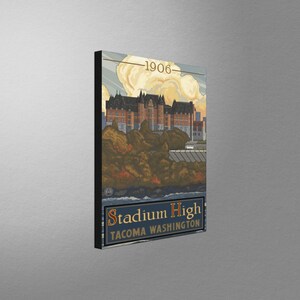 May include: Vintage-style illustration of Stadium High School in Tacoma, Washington. The image features a brick building with a large tower and a clock, surrounded by trees and a river. The text "1906" and "Stadium High Tacoma Washington" are visible.