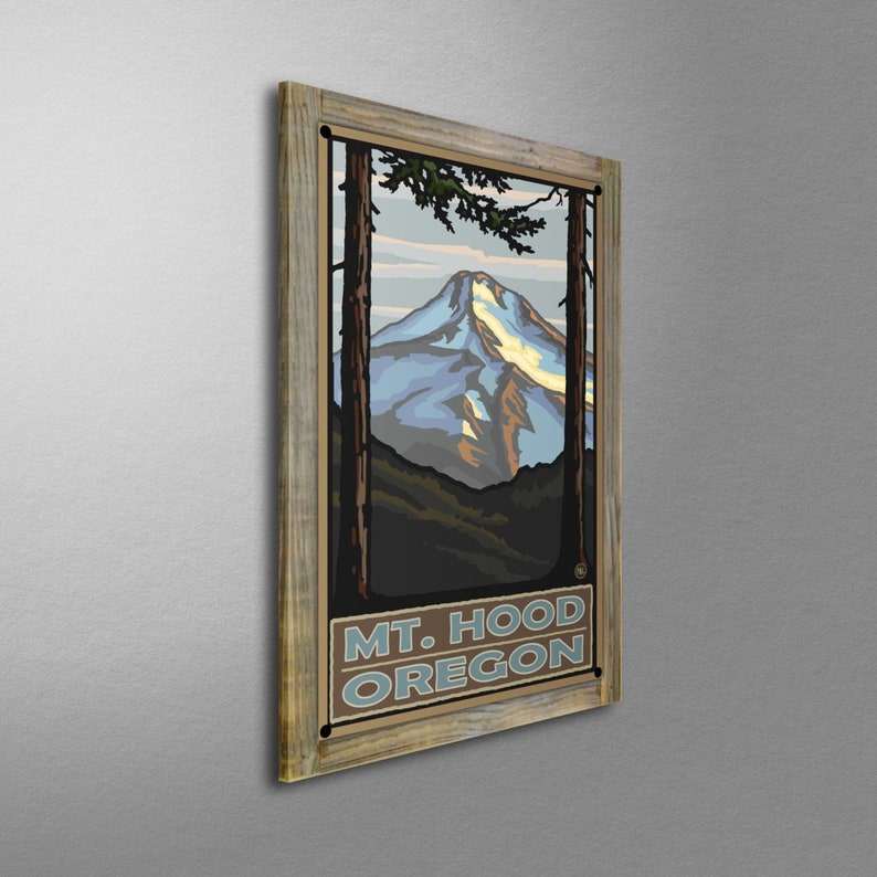 May include: A vintage-style poster with a wood frame featuring a mountain scene with a snowy peak. The poster has the text "MT. HOOD OREGON" in a blue and brown font.