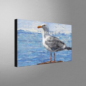 May include: A painting of a seagull standing on a wooden post with blue water and white clouds in the background.