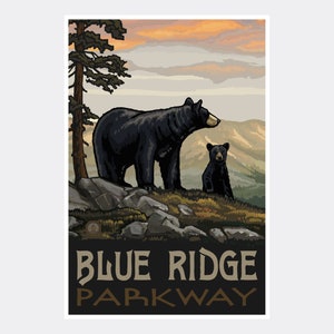 May include: A vintage-style poster featuring a black bear and cub standing on a rocky mountaintop. The sky is a vibrant orange and pink sunset. The text "Blue Ridge Parkway" is printed in brown letters at the bottom.