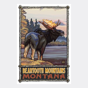 May include: A vintage travel poster featuring a black moose with large antlers standing in a forest setting. The poster has a wooden frame and the text "BEARTooth MOUNTAINS MONTANA" at the bottom.