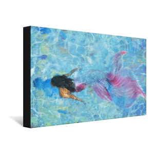 May include: A mermaid with long black hair and a pink and blue tail swims in a blue pool of water.