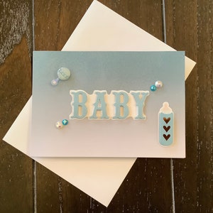 Tarjeta de felicitación hecha a mano con diseño de bebé en 3D: “Bebé”
