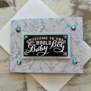 Tarjeta de felicitación hecha a mano con texto en 3D para bebé niño: «Bienvenido al mundo, bebé niño»