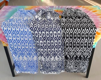 set of 3 Thai-inspired boho pants featuring traditional diamond and floral motifs in light blue, navy, and black tones