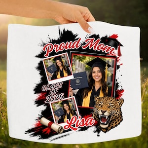 May include: White graduation-themed pillow with the words "Proud Mom," "Class of 2026," and "Lisa" in red and black. The design includes photos of a graduate, a graduation cap, and a leopard head.