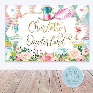 May include: A white and pink Alice in Wonderland themed party backdrop with gold lettering that reads "Charlotte's Onederland". The backdrop features a whimsical illustration of a Mad Hatter's hat, playing cards, a teapot, flowers, and a sign that reads "This Way".