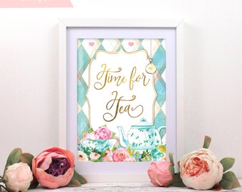 May include: A white framed print with a blue and white checkered background. The print features a gold inscription that reads "Time for Tea" with a teapot and teacup illustration. The print is surrounded by pink flowers.
