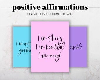 May include: Three printable affirmation cards with pastel backgrounds. The pink card says "I am strong, I am beautiful, I am enough". The blue card says "I am worth good things". The purple card says "capable".