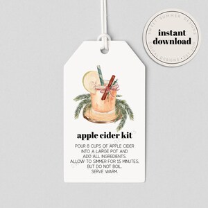 May include: A printable gift tag with a watercolor illustration of a glass of apple cider with cinnamon sticks and a star anise. The text on the tag reads "apple cider kit" and includes instructions for making apple cider.