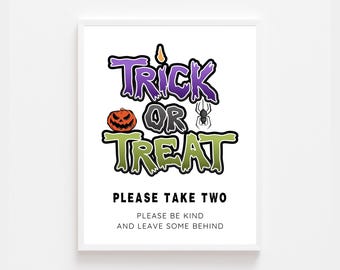 May include: A white sign with the text "Trick or Treat" in purple, green, and orange letters. The sign also includes a pumpkin and a spider. The text "Please take two" is below the main text, and the text "Please be kind and leave some behind" is below that.