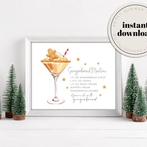 Op de afbeelding: Printbare digitale kunst met een recept voor een gingerbread martini. De illustratie toont een martini-glas gevuld met een romige drank, bedekt met een gingerbread man en een rood-wit gestreepte rietje. De tekst luidt "Gingerbread Martini" en somt de ingrediënten op: 1 fl oz gingerbread siroop, 1,5 fl oz wodka, 1 fl oz slagroom, slagroom, gingerbread kruimels. Er staat ook "Garneer met gingerbread".