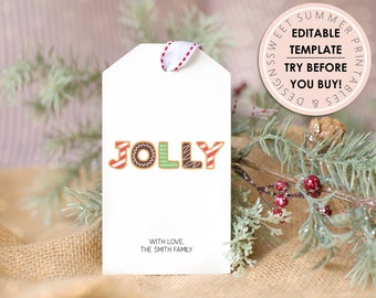Peut inclure: Étiquette cadeau blanche avec le mot "JOLLY" écrit en lettres de pain d'épices colorées. L'étiquette a un ruban rouge et blanc et le texte "Avec amour, La famille Smith".