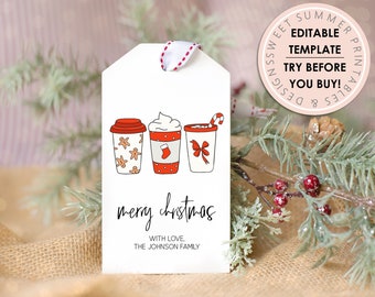 May include: A white gift tag with a red ribbon. The tag features a hand-drawn illustration of three festive drinks with whipped cream, candy canes, and gingerbread cookies. The text "merry christmas" is written in black cursive. The text "with love, the johnson family" is written in black below the illustration.