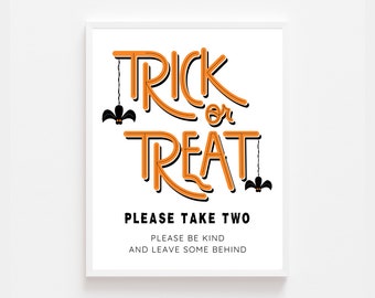 May include: Orange and black printable sign with the text "Trick or Treat" in a stylized font. The sign also includes the text "Please take two, please be kind and leave some behind."