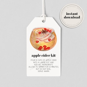May include: A printable gift tag with a watercolor illustration of a glass of apple cider with cinnamon sticks, cranberries, and apple slices. The text on the tag reads "apple cider kit" and includes instructions for making apple cider.