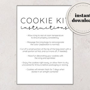 May include: A white printable instruction sheet for a cookie kit. The sheet has the title "COOKIE KIT instructions" and includes instructions for decorating cookies with icing and sprinkles. The sheet also includes instructions for storing cookies to keep them fresh.