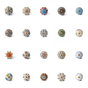 May include: A selection of twenty decorative ceramic cabinet knobs. Each knob features a unique hand-painted floral or geometric design in various colours, including blue, orange, white, and green. The knobs are round and have a metal screw for installation.