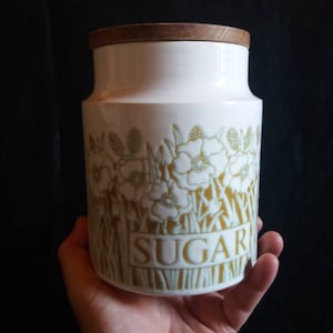 Vintage Hornsea Fleur sugar storage jar with wooden lid and rubber seal.
