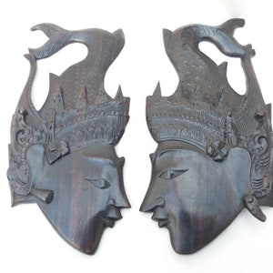Vintage carved wooden plaques pair. Balinese mask. east Asian art. ebonised wood. wall hanging. ethnic chic.