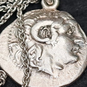 Vintage Alexander the Great Athena Nike Greek pendant. White metal coin pendant and chain.