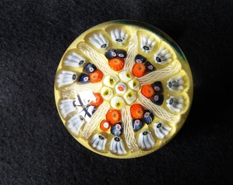 vintage Strathearn glass millefiore paperweight in blue, red, yellow and white on yellow. seven spoke latticino canes. Scottish Glass. S78