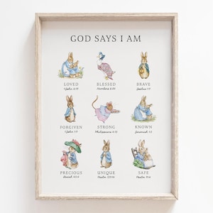 May include: A framed print with the text "GOD SAYS I AM" and illustrations of bunnies and a mouse. The print includes words like "LOVED," "BLESSED," "BRAVE," "FORGIVEN," "STRONG," "KNOWN," "PRECIOUS," "UNIQUE," and "SAFE."
