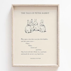 May include: Framed print of "The Tale of Peter Rabbit" by Beatrix Potter. The artwork features a beige background with black text and illustrations of four rabbits. The text includes the title, a short story excerpt, and the author's name.
