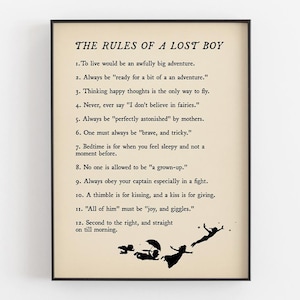 May include: Framed print with the text "THE RULES OF A LOST BOY" and twelve rules in black font on a cream-coloured background. The bottom of the print features black silhouettes of characters.