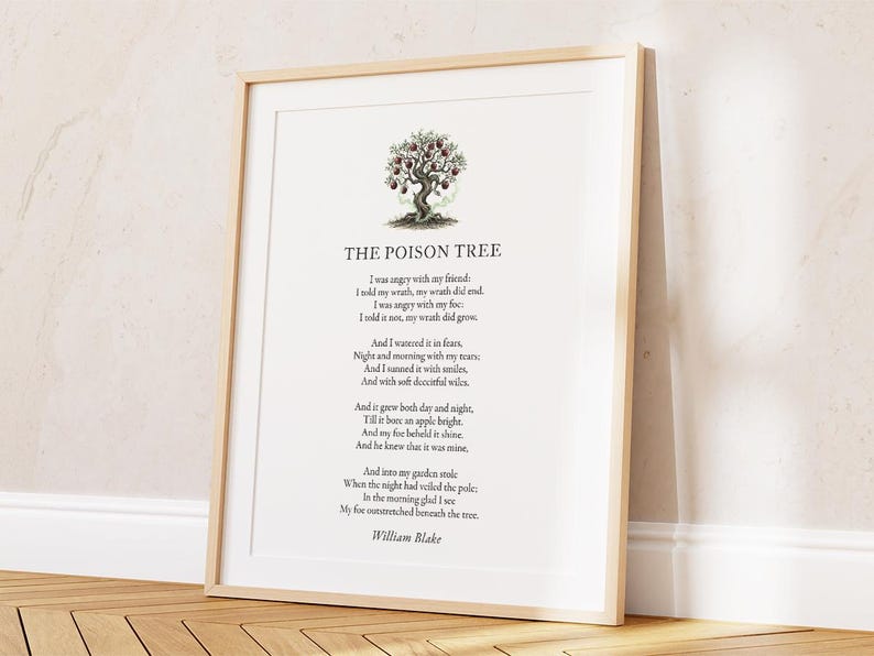 May include: A framed print of William Blake's poem "The Poison Tree." The text is in black on a white background, with a tree illustration. The frame is light wood-toned. The print is displayed against a neutral wall, suitable for home decor.