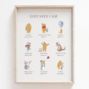 May include: A framed print with the text "GOD SAYS I AM" at the top, featuring illustrations of Winnie the Pooh characters with words like "LOVED," "BRAVE," and "WISE." The print has a light wood-tone frame.